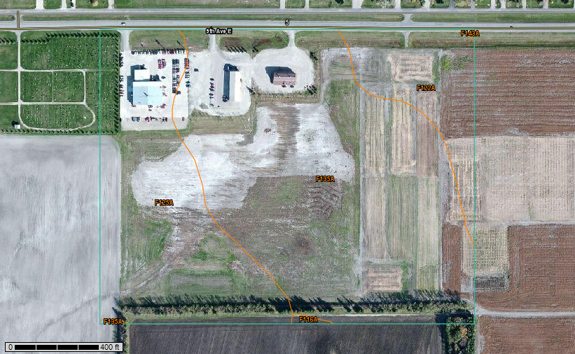An aerial view of trial plots at Langdon REC, with a diagonal line marking the boundary between Cavour-Cresbard loams (west) and Hamerly-Cresbard loams (east).
