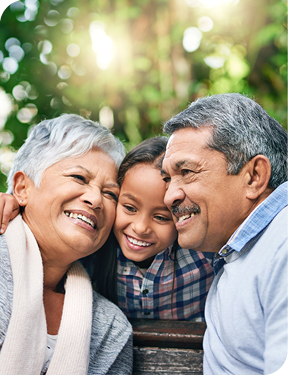 Smiling grandparents and grandchild