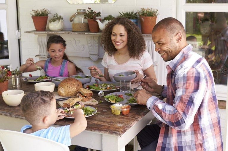 Family eating a meal with many whole grain items
