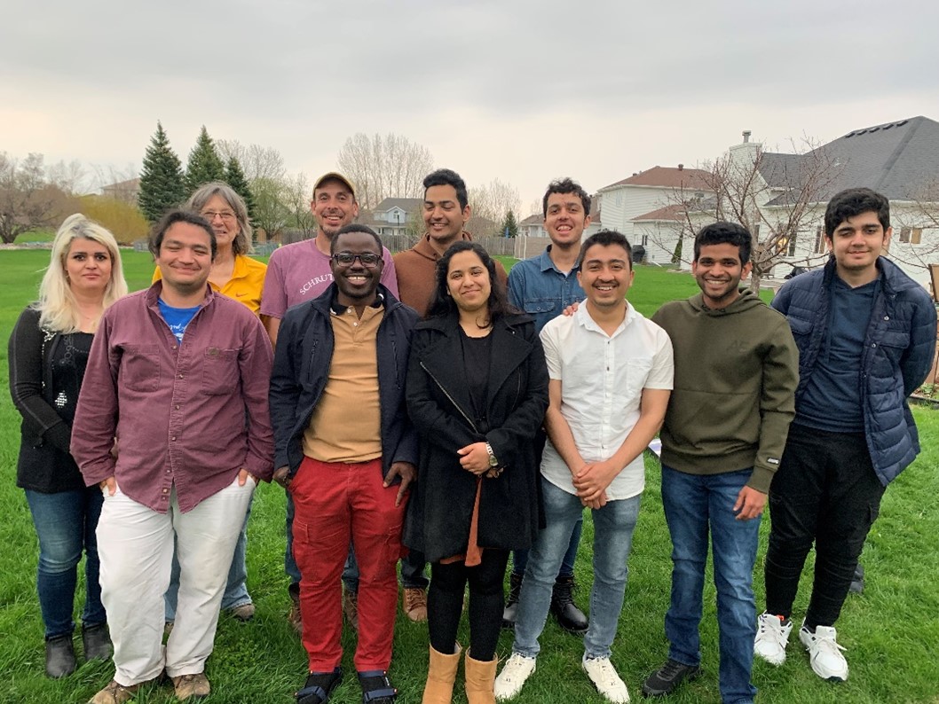 seven people posing for a photo