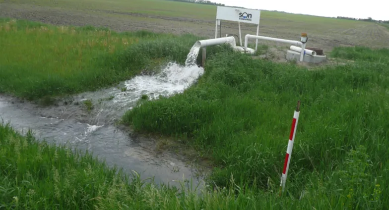 Agriculture pump pumping water in a crop field