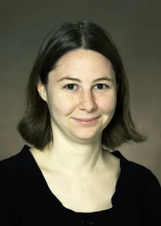 Erin Conwell smiling confidently at camera. 