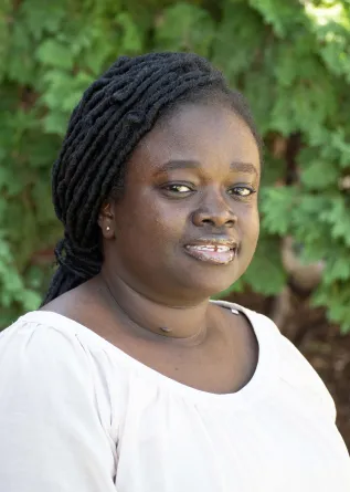 Lois smiling at the camera.