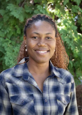 Dana is smiling at the camera.