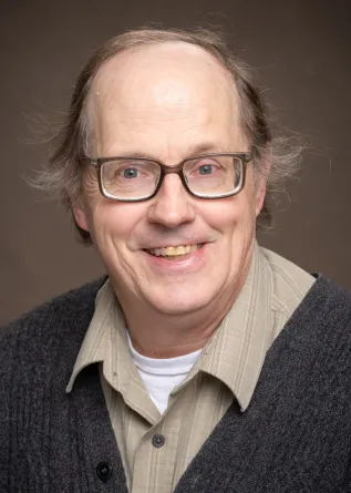 John Hershberger smiling confidently at the camera