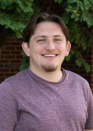 Isaac smiling at the camera