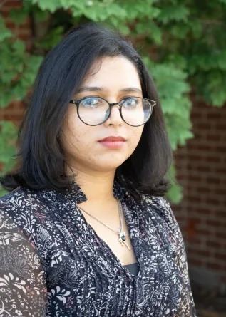 Zakia smiling at the camera