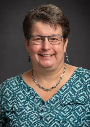 Montplaisir smiling confidently at camera