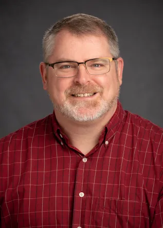 Tony smiling at the camera