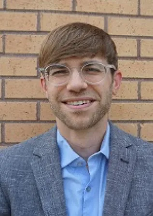 Dr. Jeremy Hamm confidently staring at the camera