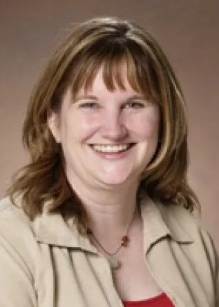 Dr. Linda Langley confidently staring at the camera