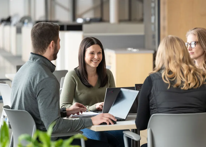 students talking about an assignment