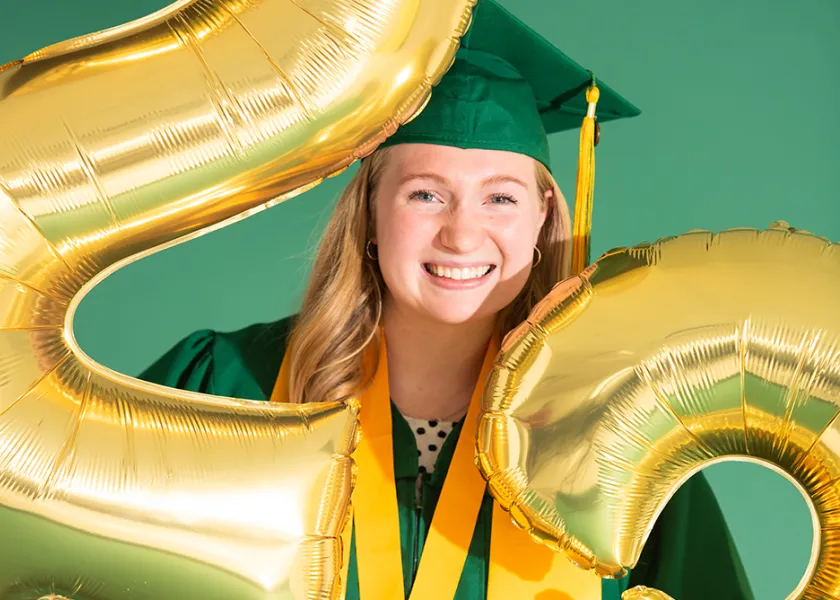ndsu graduate holding 2023 balloons