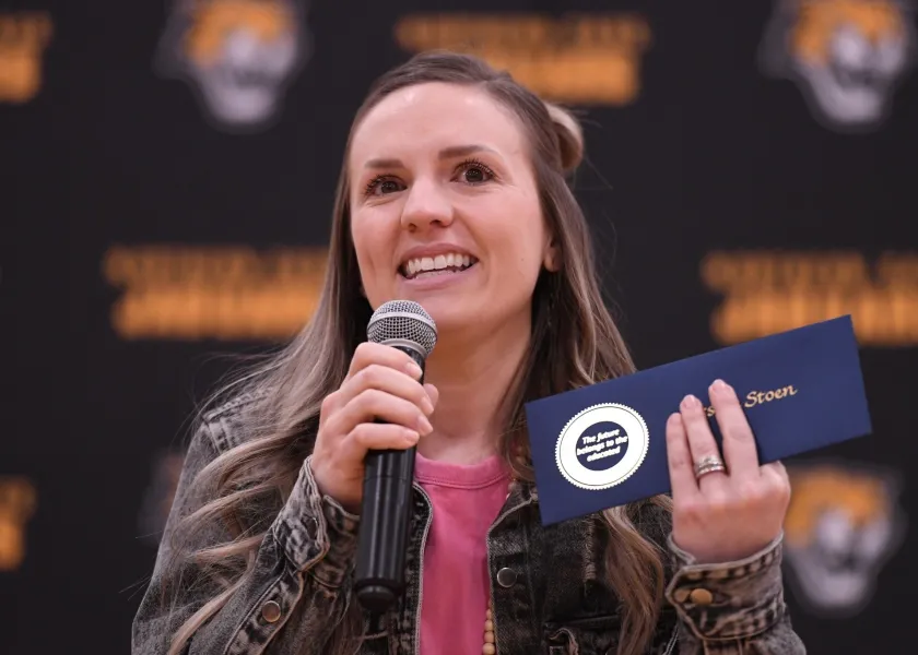woman speaking into a microphone