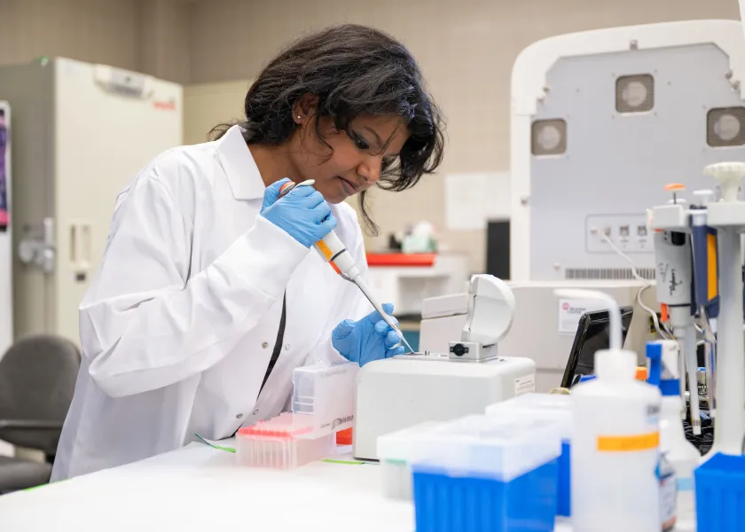 student working with samples in a lab