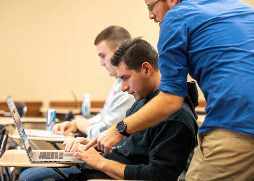 professor helping a student in class