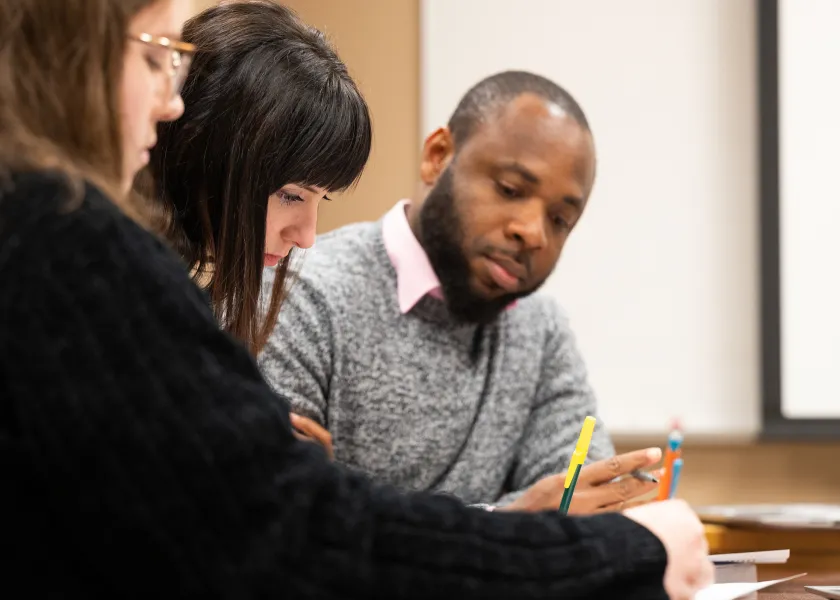 students working on an assignment in class