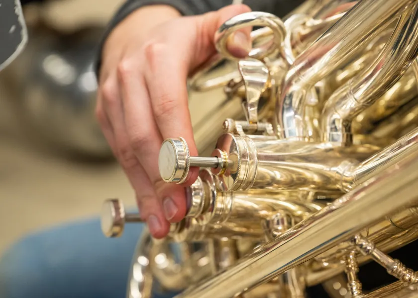 student playing a brass instrument
