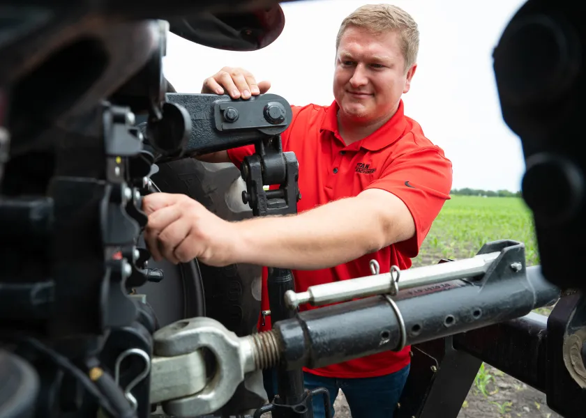 student working on a piece of machinery