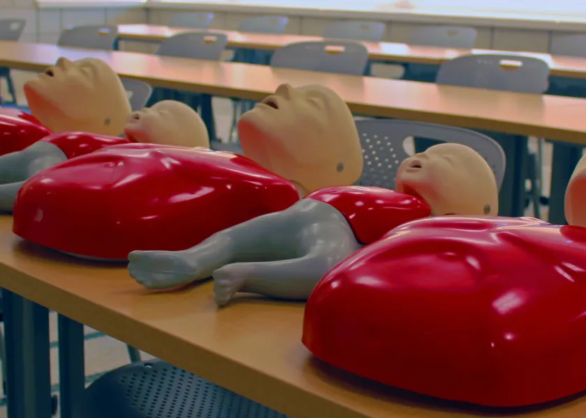 CPR mannequins on tables
