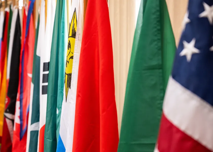 close up of various flags representing many countries