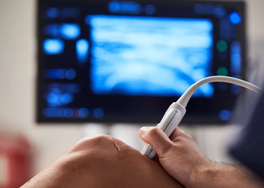 A patient's knee getting an ultrasound.