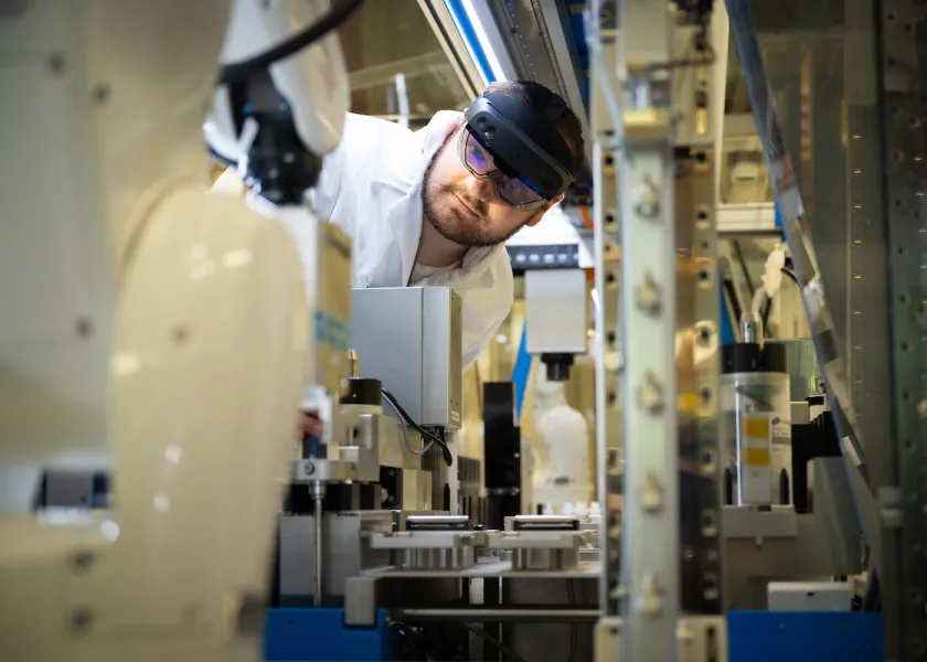 student working with coatings and polymers equipment
