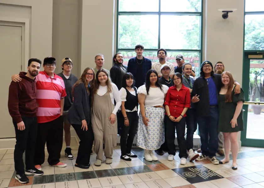 The 13 students from three tribal colleges pose for a photo at 线上赌博app