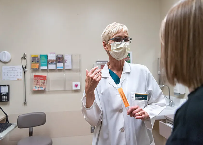 Student Health Service nurse helping a student