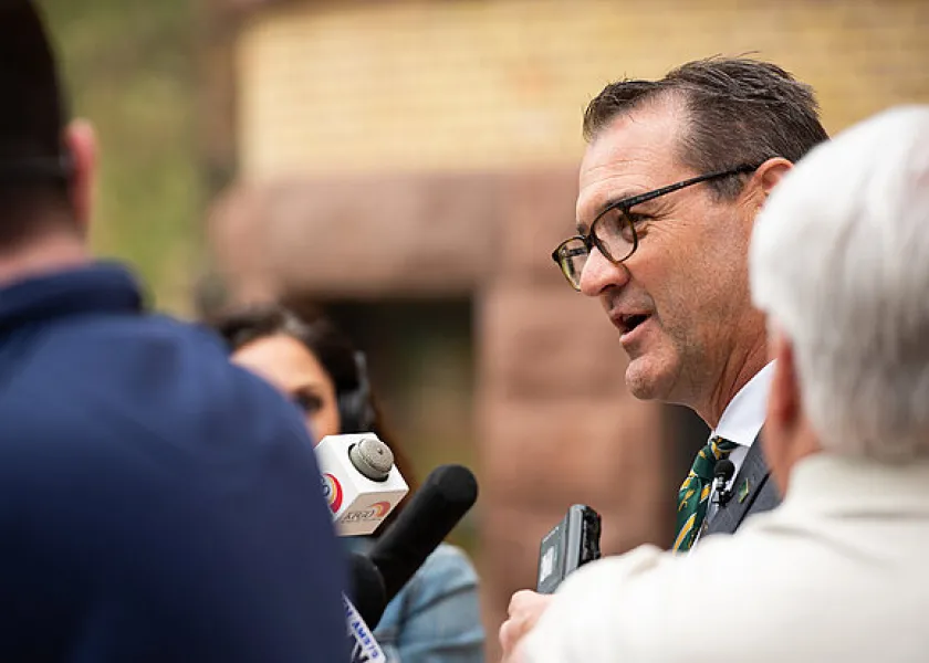 线上赌博app President David Cook speaking with the media on his first day
