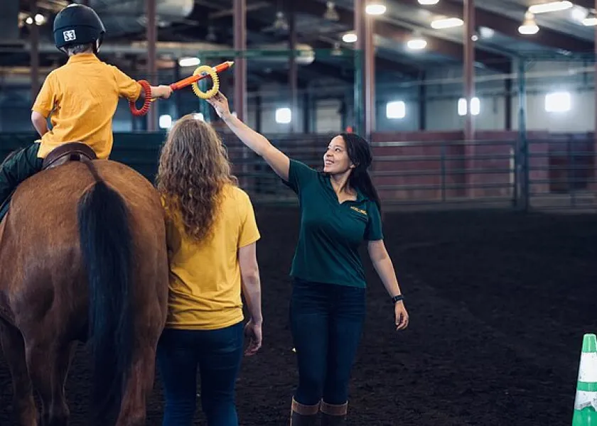 Bison Strides staff helping a student
