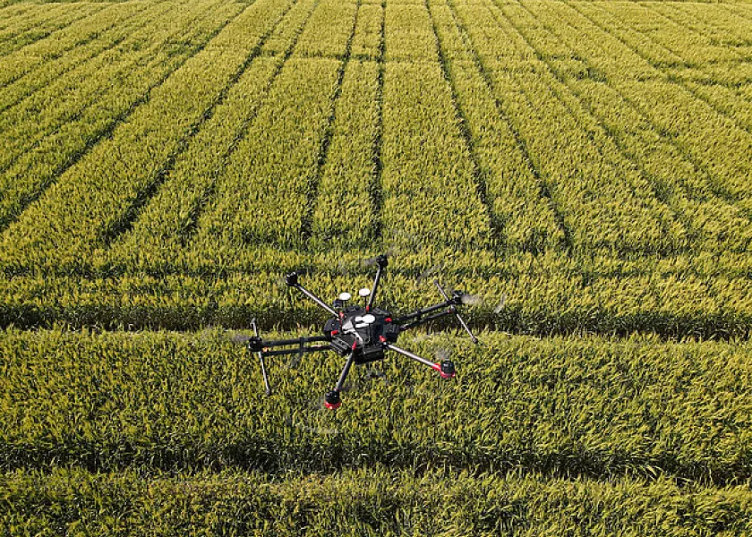 a drone flying over a field