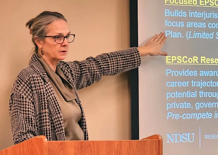 Heidi Grunwald speaking at a lecturn.