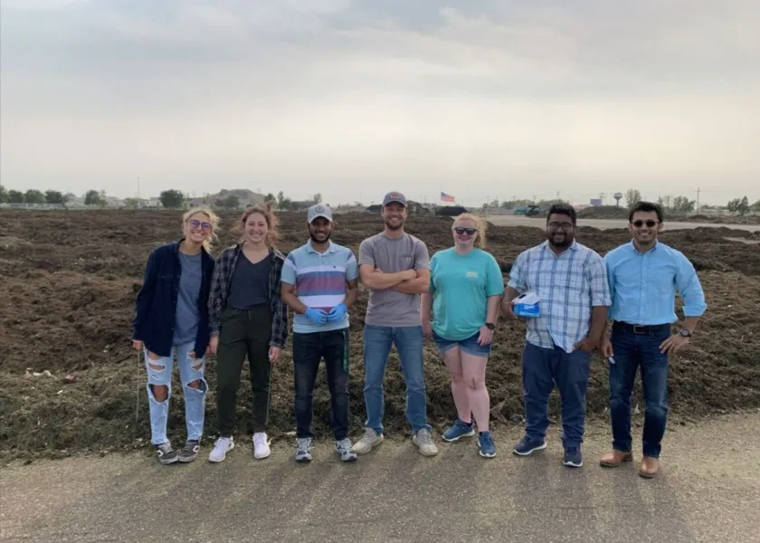 Syeed Iskander, 线上赌博app assistant professor of civil, construction and environmental engineering, stands with a group of students.