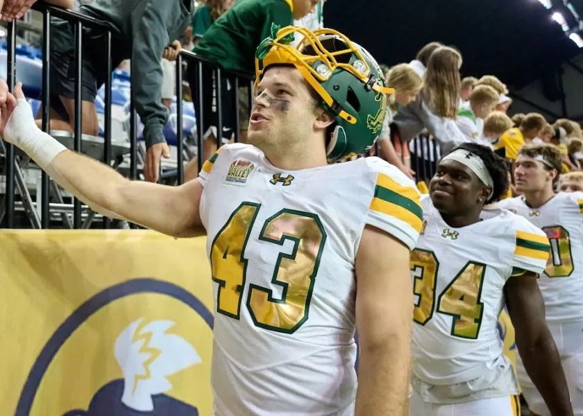 Logan Kopp celebrates a win with fans.