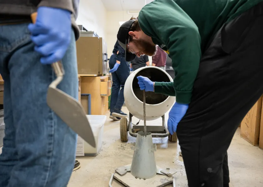 construction engineering students working with concrete