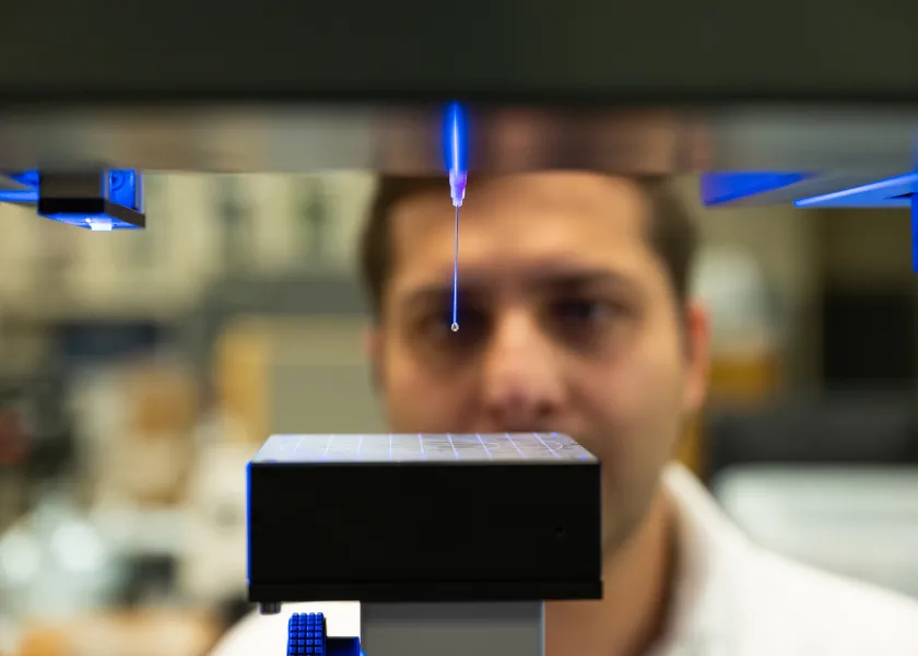 student conducting research in Coatings and Polymers