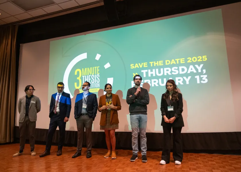 students taking part in the Three Minute Thesis competition to discuss their research