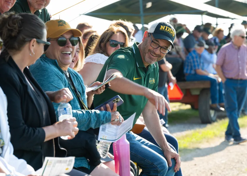 President Cook speaking with other attendees during 线上赌博app Field Days