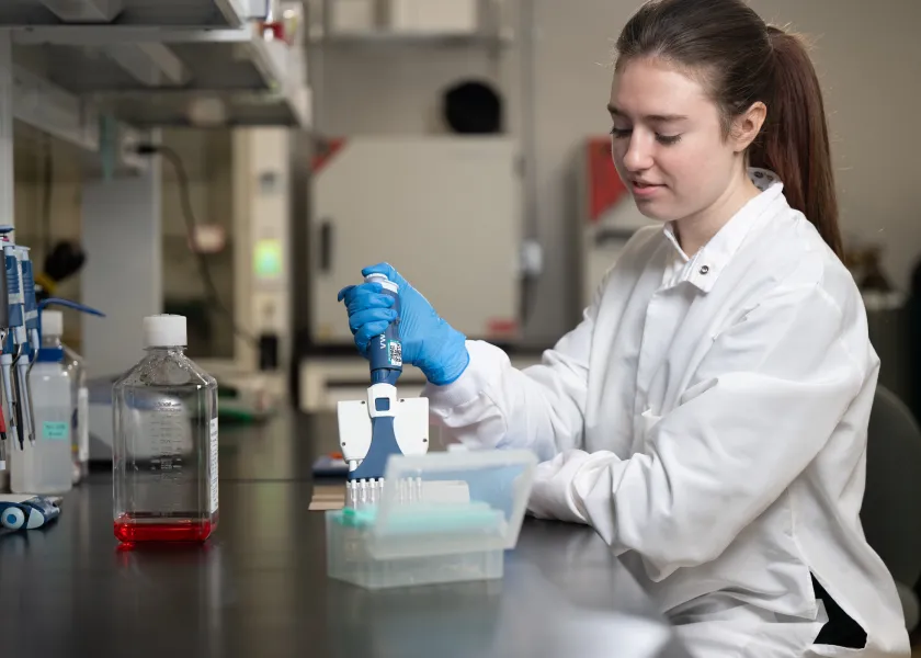 student conducting pharmacy research in a lab