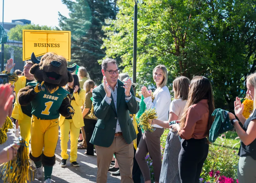 President Cook greeting new students during Walk Through the Gates