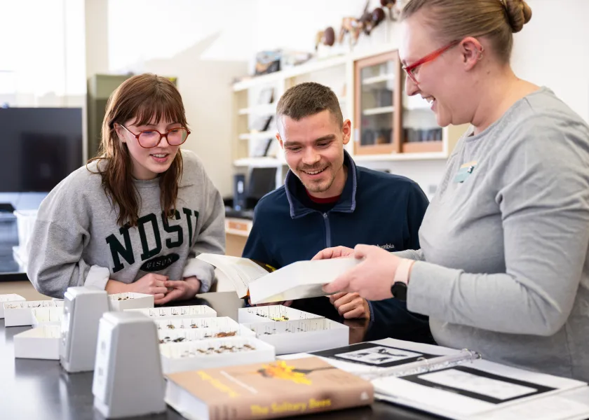 student interact with faculty during an entomology class