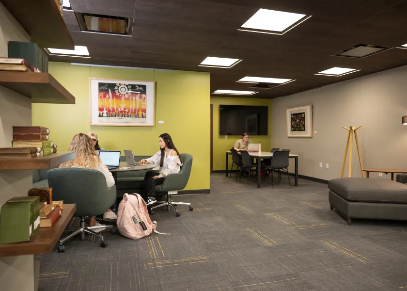 students using the library to study in a group