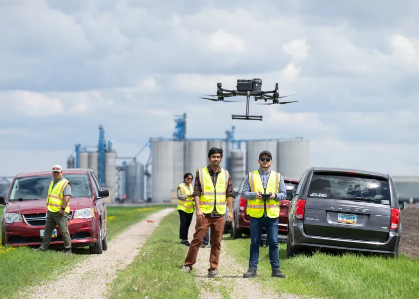 student operate a drone as part of a precision agriculture class