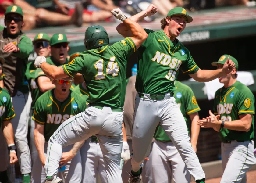 baseball players celebrate a game milestone