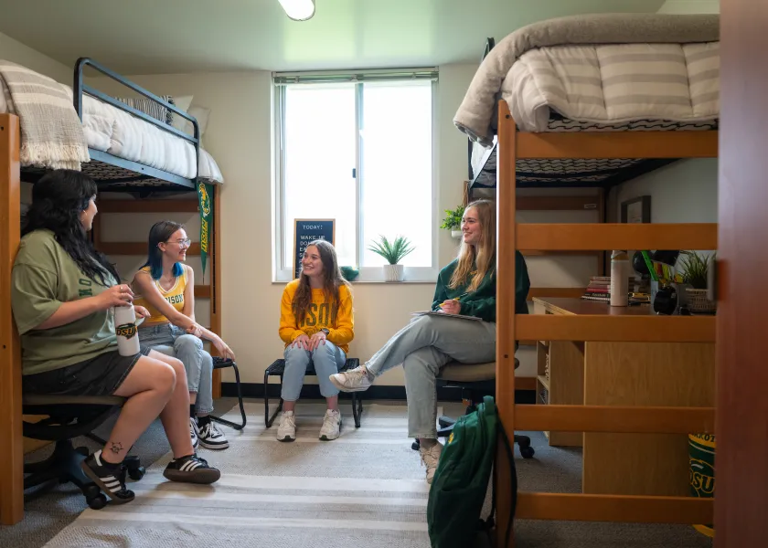students gathered in a Pavek Hall room