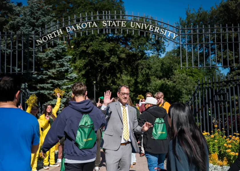 President Cook greeting new students during Walk Through the Gates