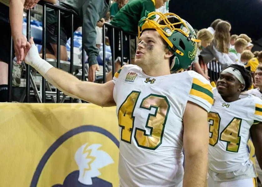 Logan Kopp celebrates a win with fans.