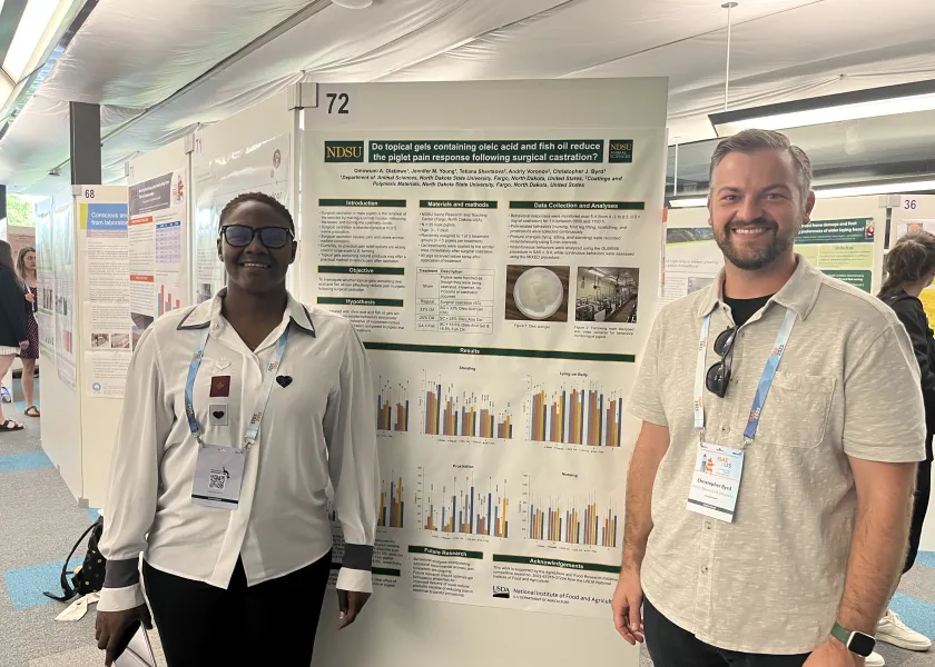 Student and professor with poster 