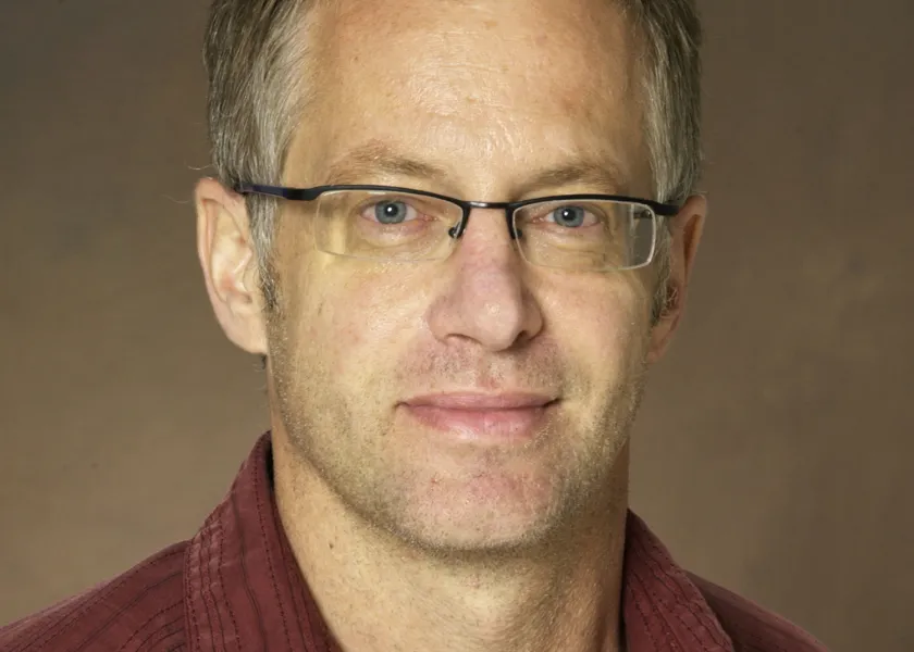   Erik Hobbie smiling confidently at camera.